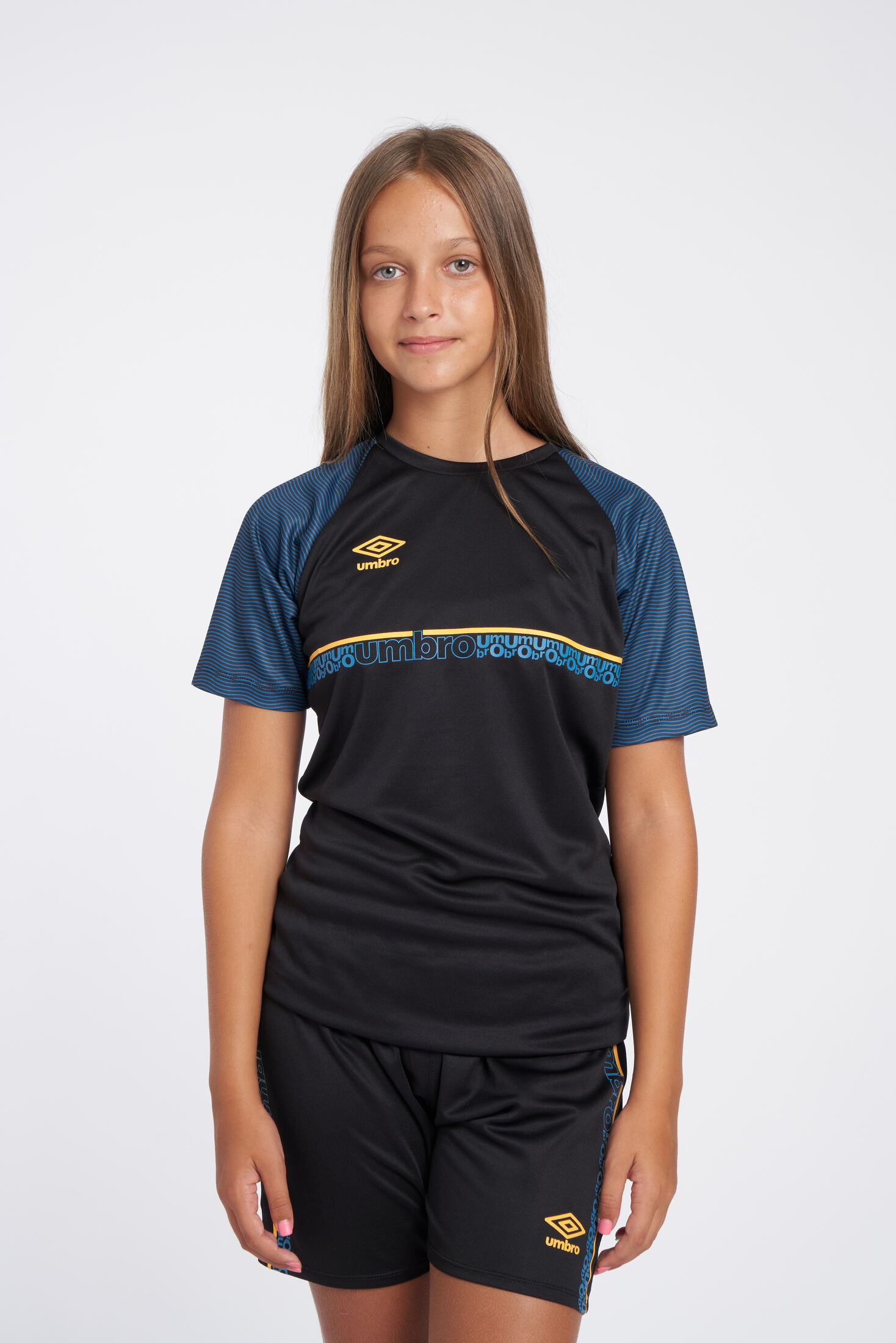 CAMISETA UMBRO SPIRITO JERSEY - JNRBLACK / ORANGE POP / PETROL BLUE 